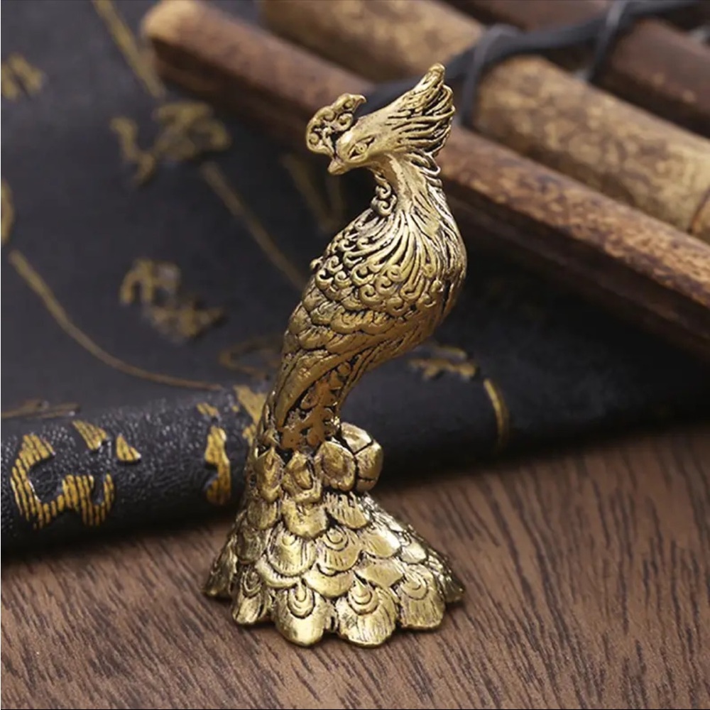 Ornate brass peacock
